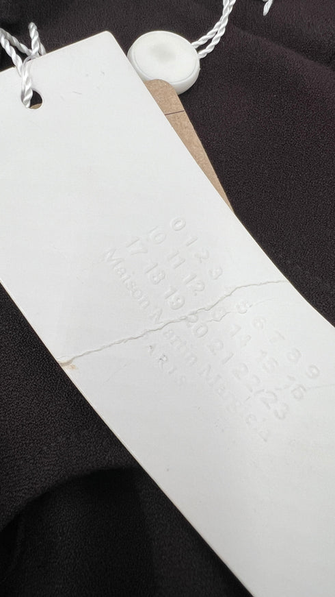 Tuta scollo cuore con cartellino