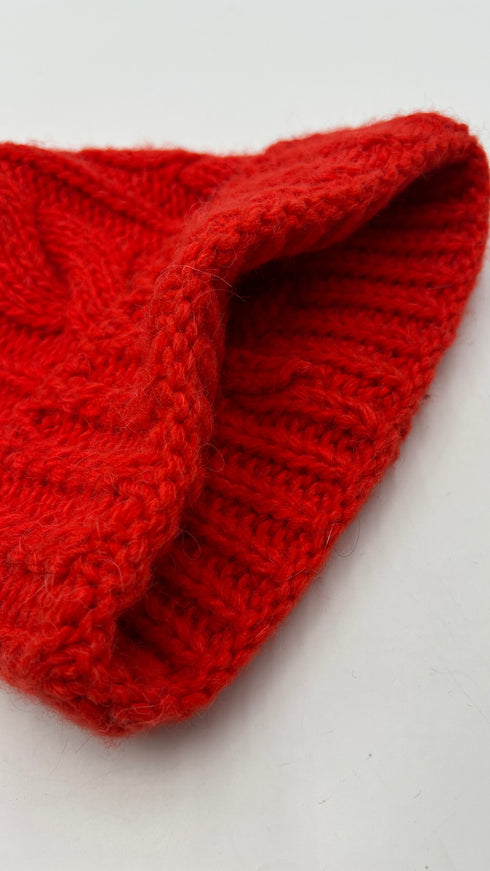 Cappello a trecce con pompon