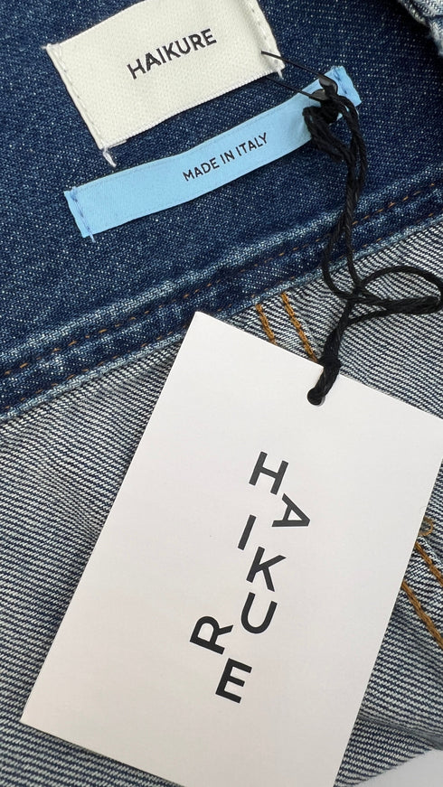 Gilet in denim con cartellino