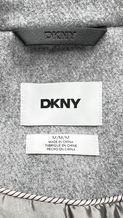 Cappotto con strass e cartellino