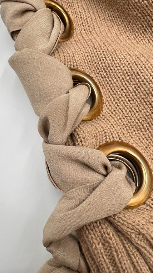 Dolcevita oversized con fiocchi