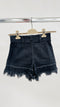 Shorts in denim sfrangiato