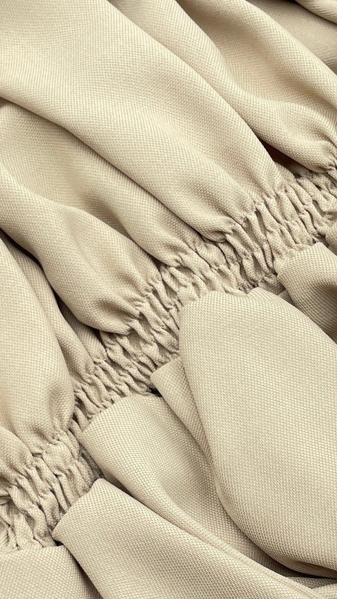 Blusa arricciata con cartellino