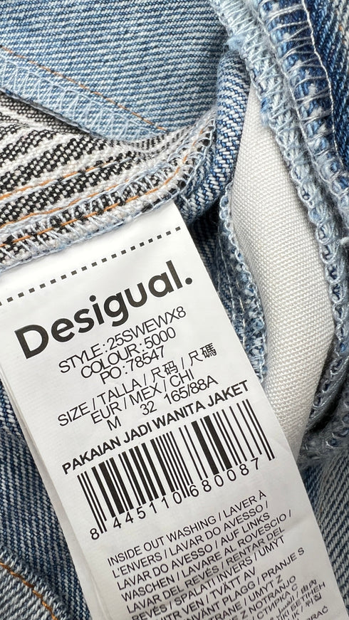 Gilet in denim con cartellino