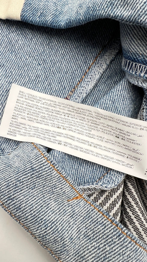 Gilet in denim con cartellino