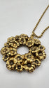 Collana dorata con pendente floreale vintage
