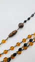 Collana lungai in resina nera e ambra