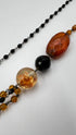 Collana lungai in resina nera e ambra