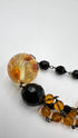 Collana lungai in resina nera e ambra
