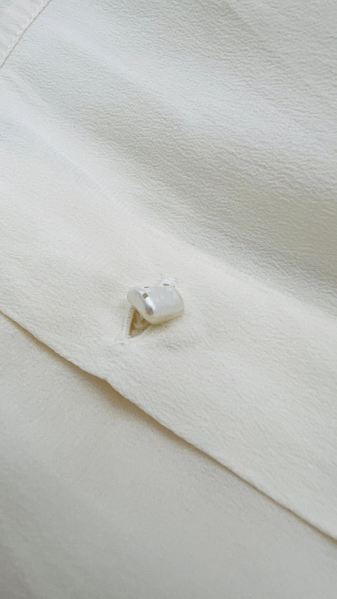 Blusa girocollo in seta con fiocco