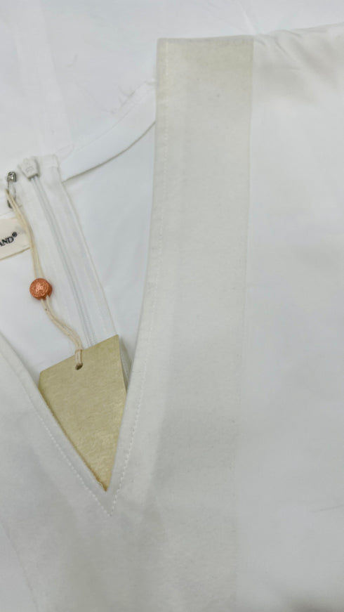 Top scollo V con cartellino