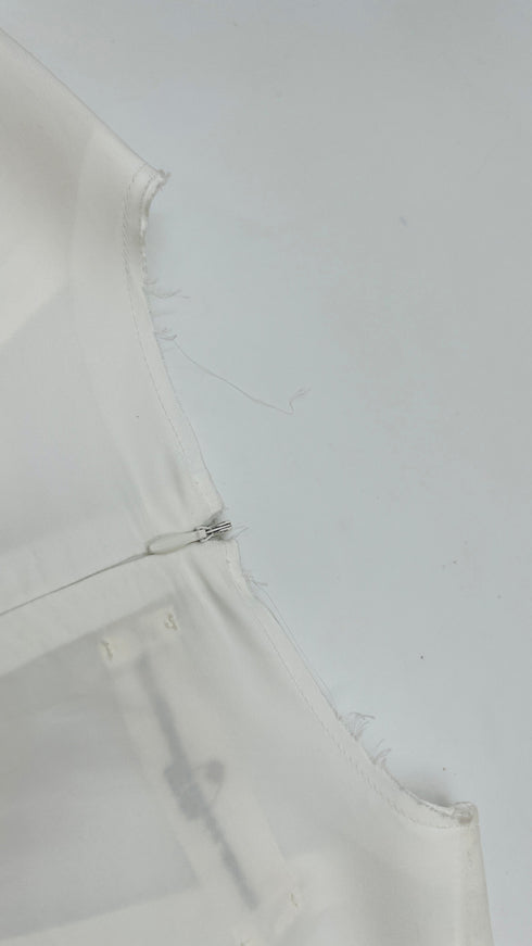 Top scollo V con cartellino