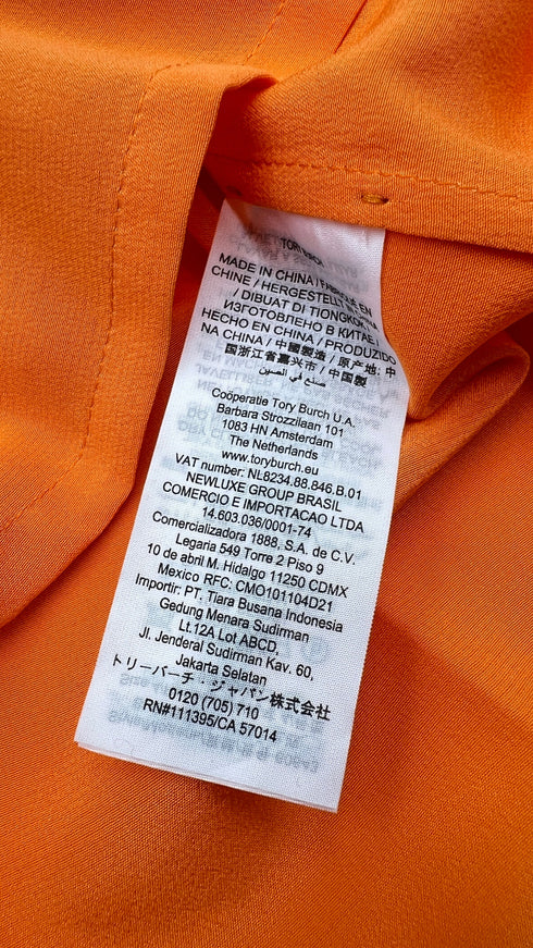 Blusa in seta con cartellino