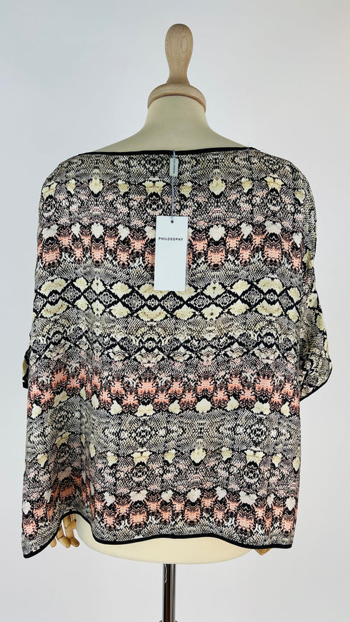 Top in seta con cartellino