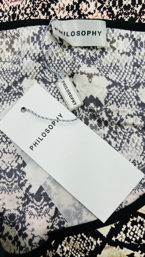 Top in seta con cartellino