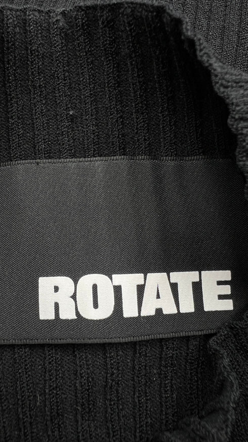 Top a coste con maxi polsini