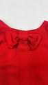 Blusa rossa con fiocco