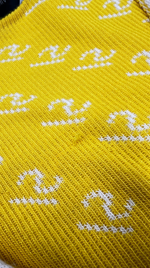 Cardigan corto con cartellino