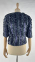 Bolero in pelle con cartellino