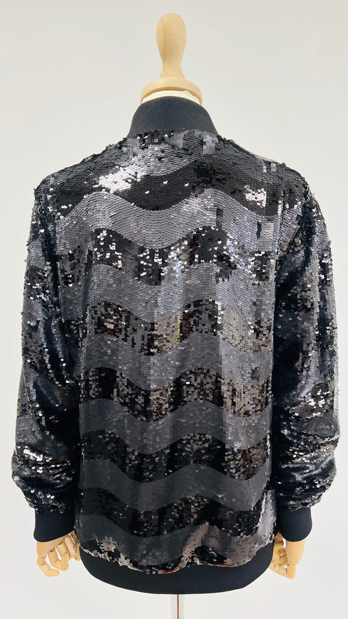Bomber nero di paillettes con cartellino