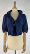 Bolero blu con cartellino