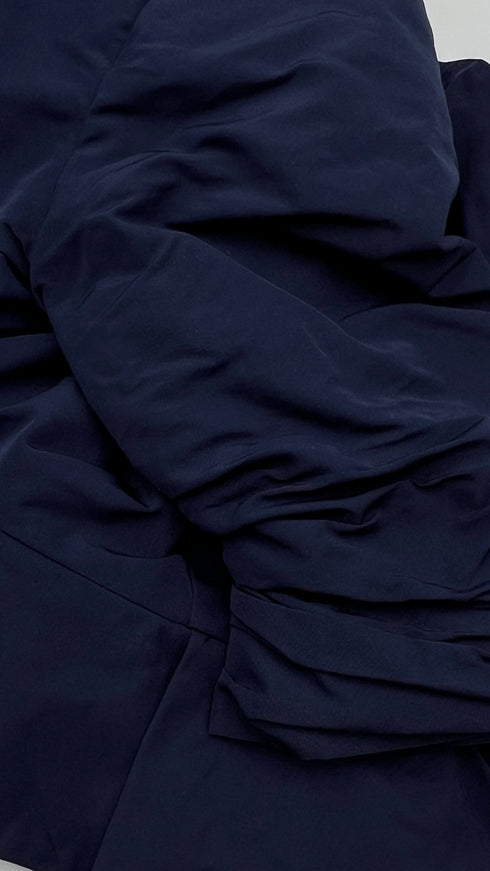 Bolero blu con cartellino