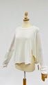 Maglia bianca asimmetrica