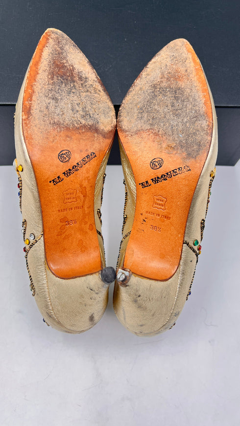 Décolleté dorate con appliqués