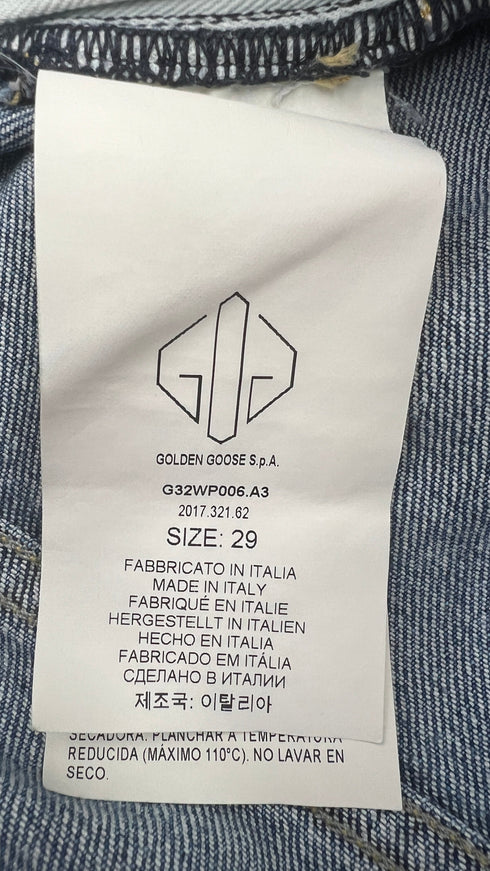 Jeans slim con cartellino