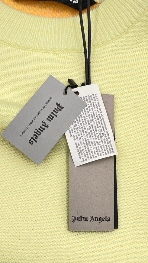 Maglione oversized con cartellino