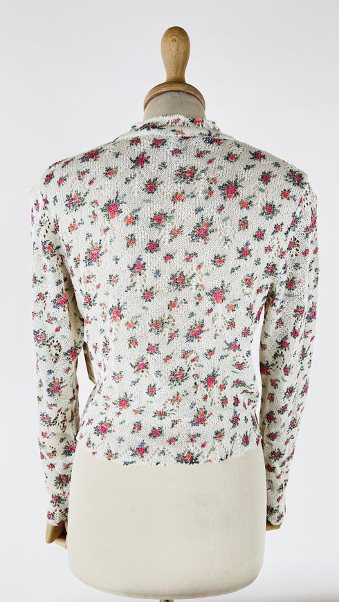 Cardigan floreale con bottoni gioiello
