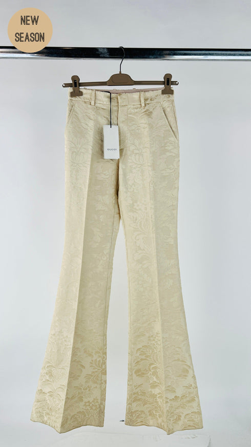 Pantaloni flared damascati con cartellino