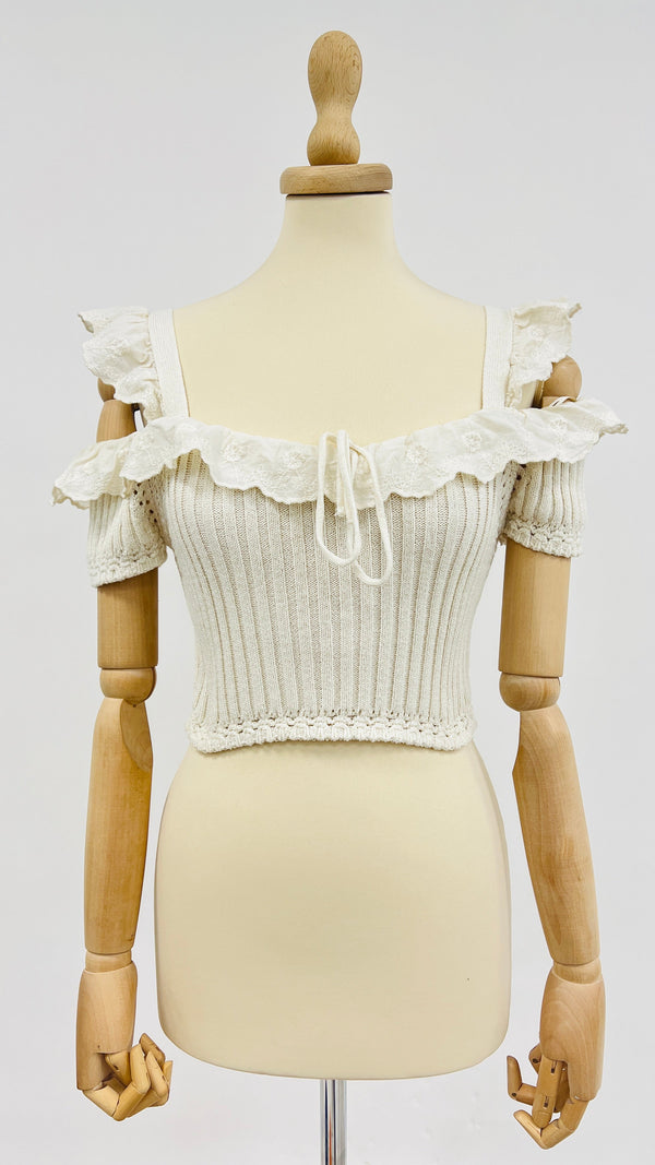 Top in maglia con rouche