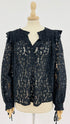 Top in pizzo con cartellino