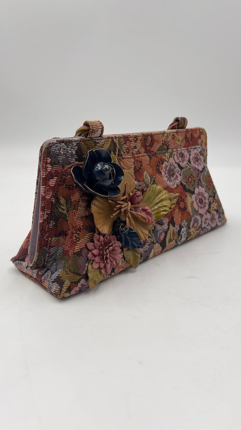 Clutch in jacquard con appliqués