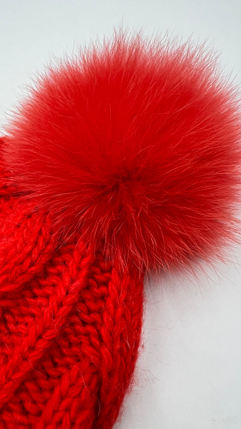 Cappello a trecce con pompon