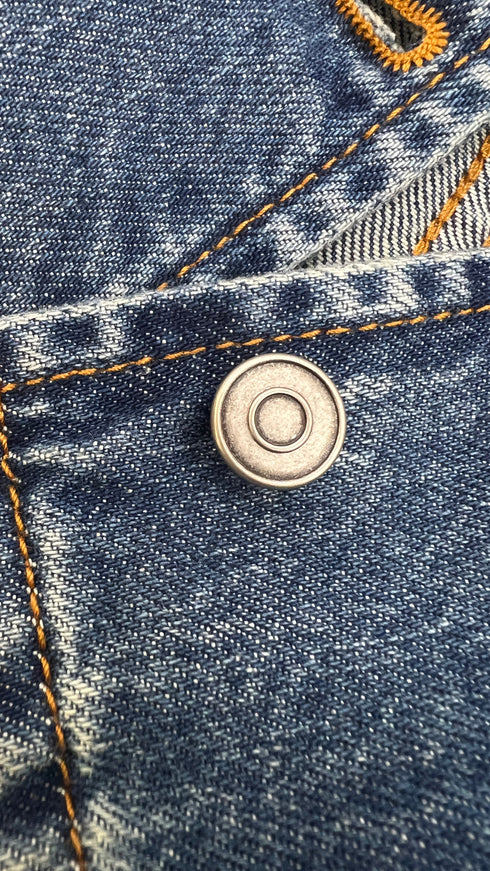 Gilet in denim con cartellino