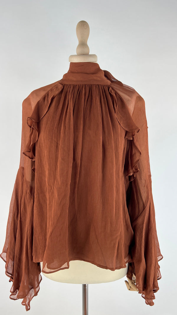 Blusa con fiocco e cartellino