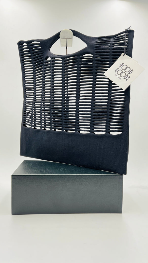 Tote traforata con cartellino