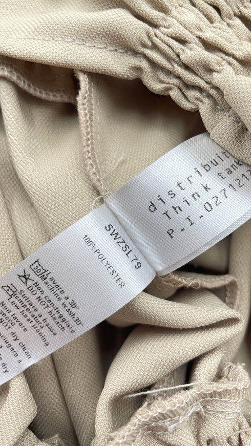 Blusa arricciata con cartellino