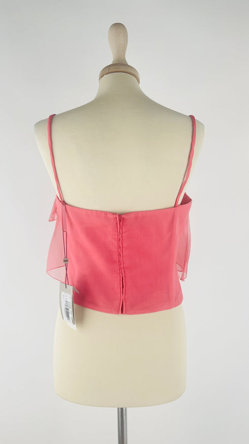 Top elegante con cartellino