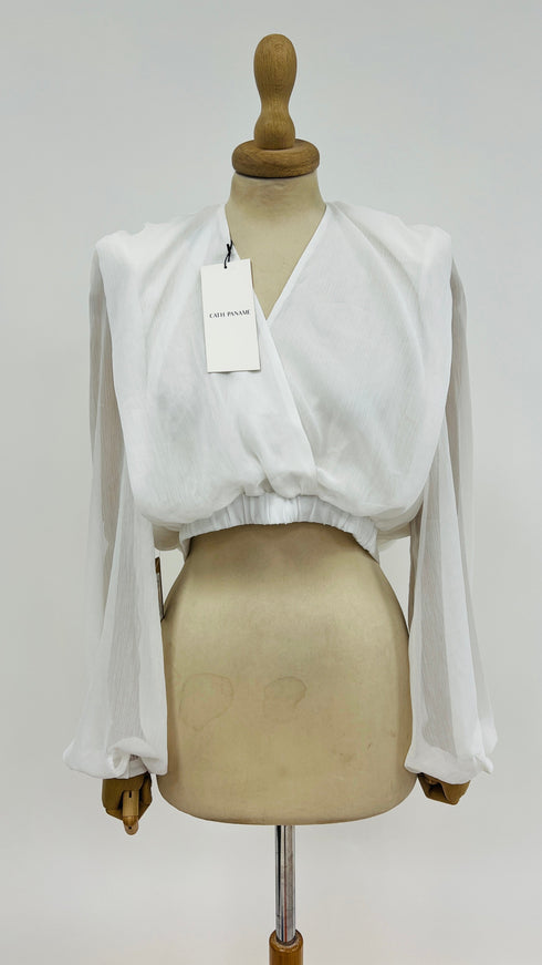 Blusa con spalline con cartellino