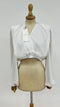 Blusa con spalline con cartellino