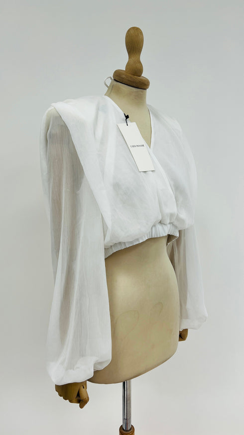 Blusa con spalline con cartellino
