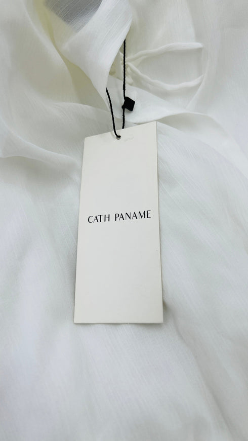 Blusa con spalline con cartellino