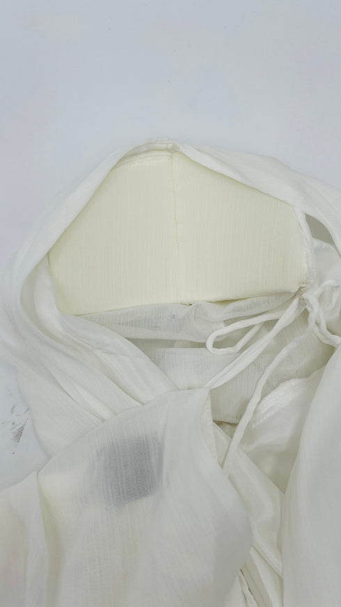 Blusa con spalline con cartellino
