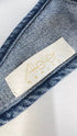 Top denim con nodo