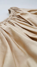 Top monospalla con cartellino Solace london