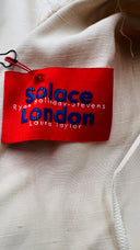Top monospalla con cartellino Solace london