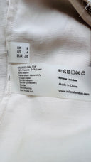 Top monospalla con cartellino Solace london